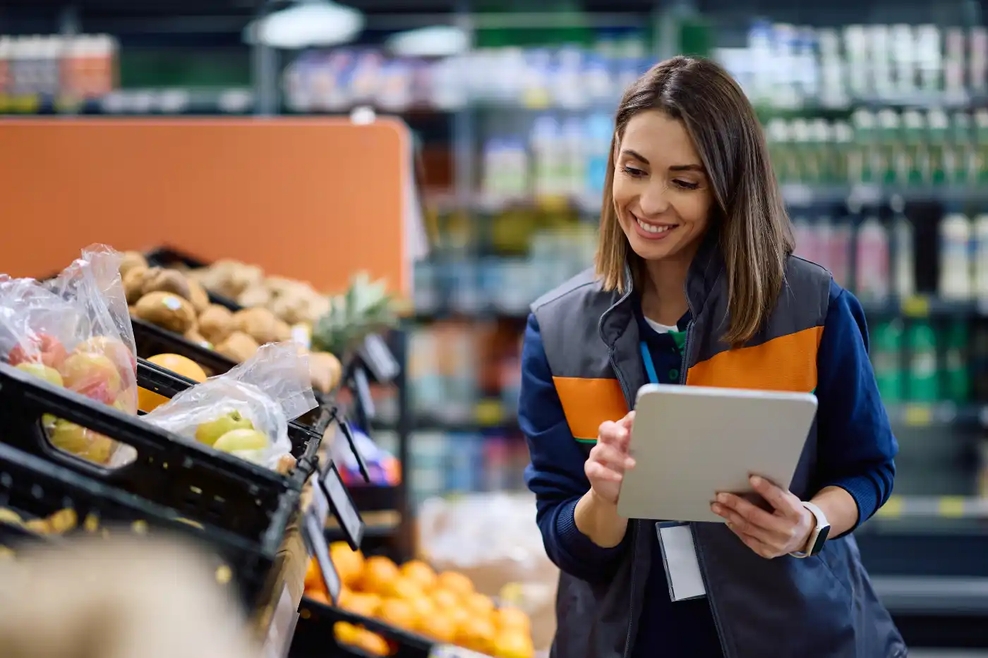 Organic supply-chain quality manager reviewing supplier information on a phone